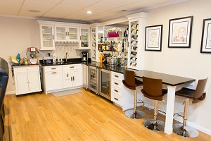 A basement bar installed in a finished basement in Oyster Bay
