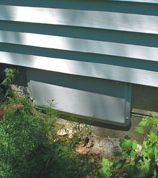 A gray crawl space vent cover in Great Neck