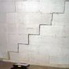 A diagonal stair step crack along the foundation wall of a New Hyde Park home