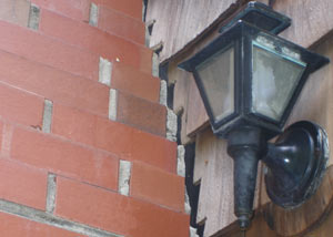 A tilting chimney in Great Neck showing serious foundation damage.