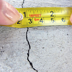 A crack in a poured concrete wall that's showing a normal crack during curing in Wantagh