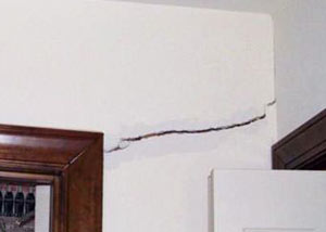 A large drywall crack in an interior wall in Bay Shore