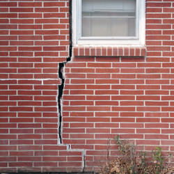 A foundation with a large crack that's wider at the top than on the bottom in Baldwin