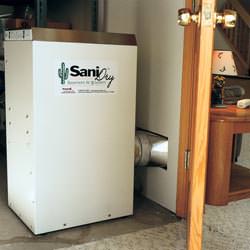 A basement dehumidifier with an ENERGY STAR® rating ducting dry air into a finished area of the basement  in Wantagh