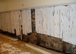 A wet, flooded finished basement in Ronkonkoma