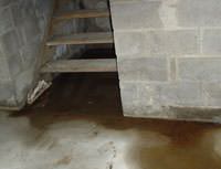 Water Pouring into a New Rumley Basement through Hatchway Doors